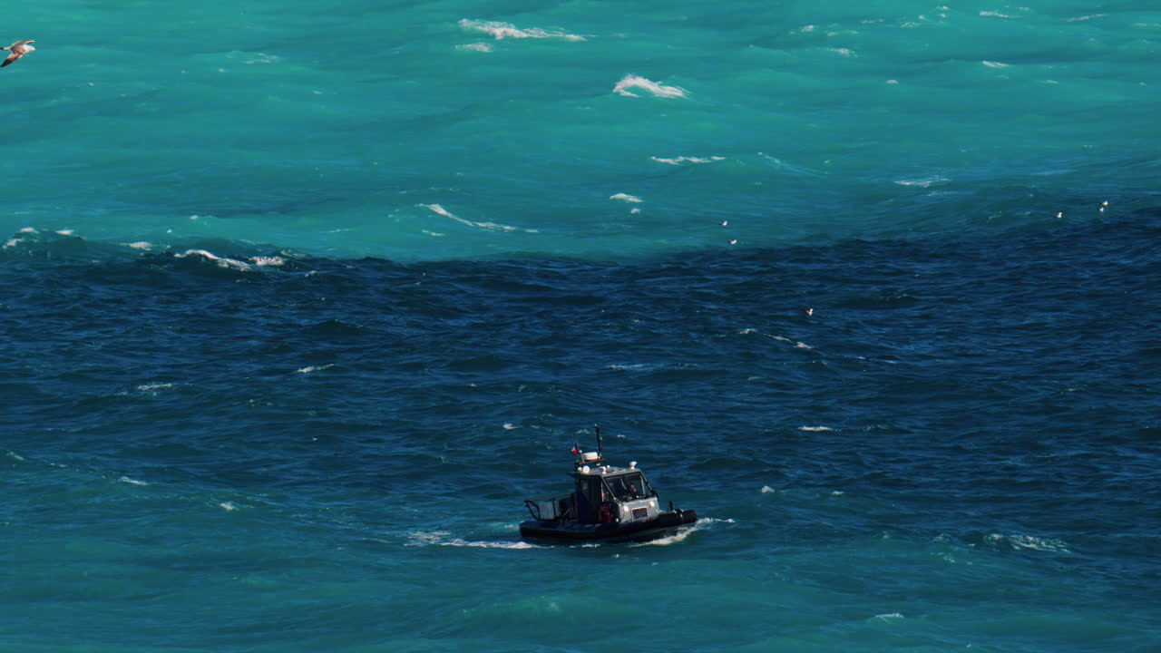 Nice, France - March 17, 2025: Small boat moving on the blue sea in daylight