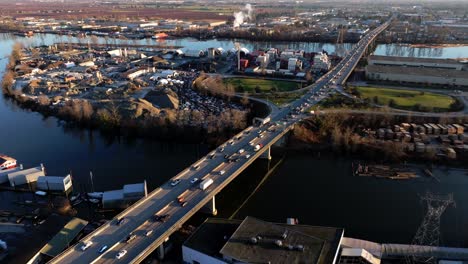 Vehicles-Driving-Through-Knight-Street-Bridge-Over-Fraser-River-In-Richmond,-British-Columbia,-Canada