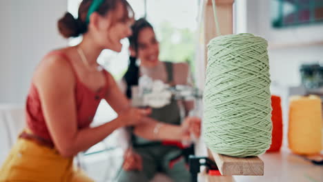 two women creating with yarn