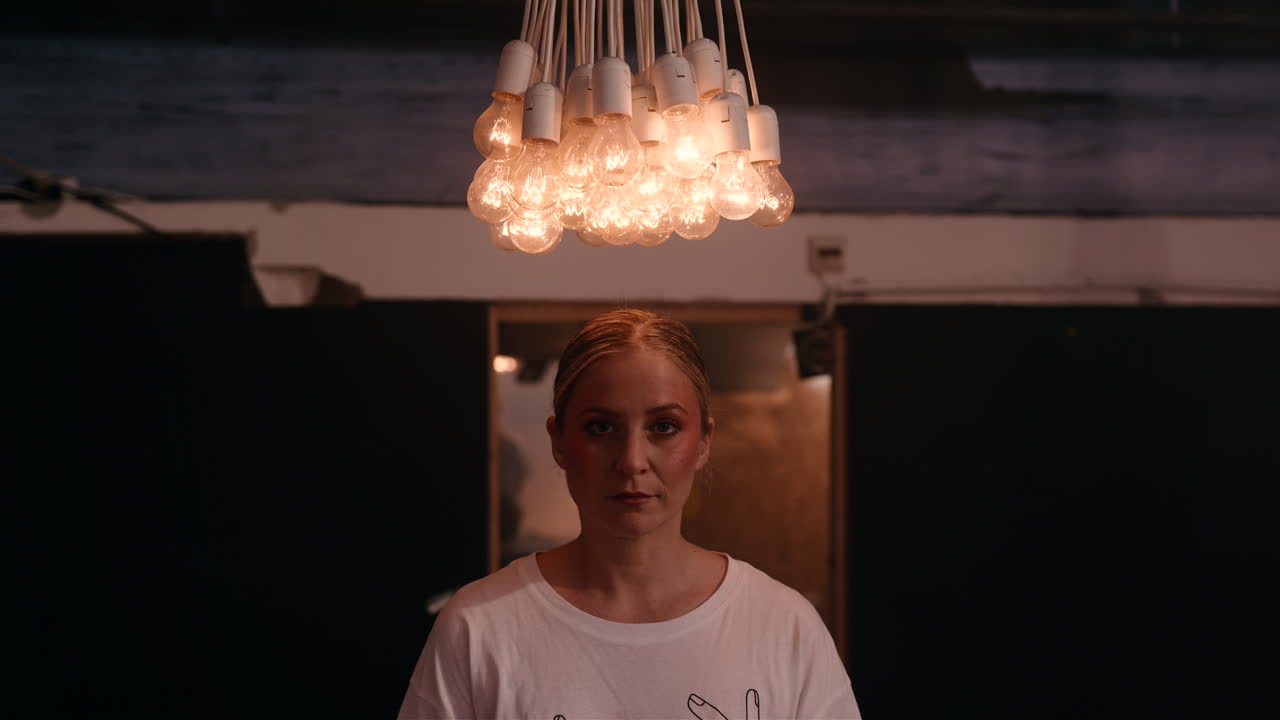 Woman in a cafe with a unique light fixture