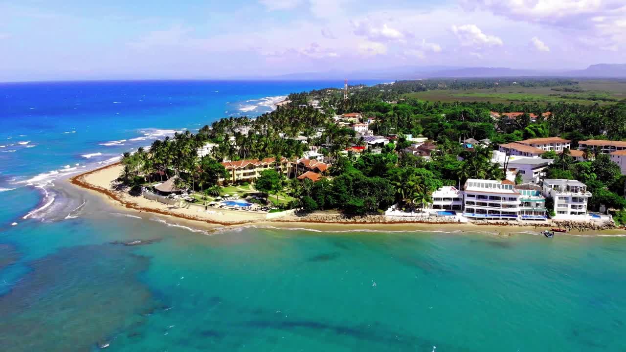 Sunny Dominican Republic shoreline with gentle surf