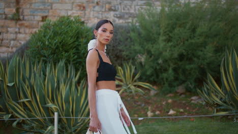 stylish woman in a city garden