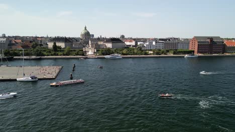 Amalienborg-Palace-with-Tour-Boat-Aerial-Pan,-Copenhagen,-Denmark