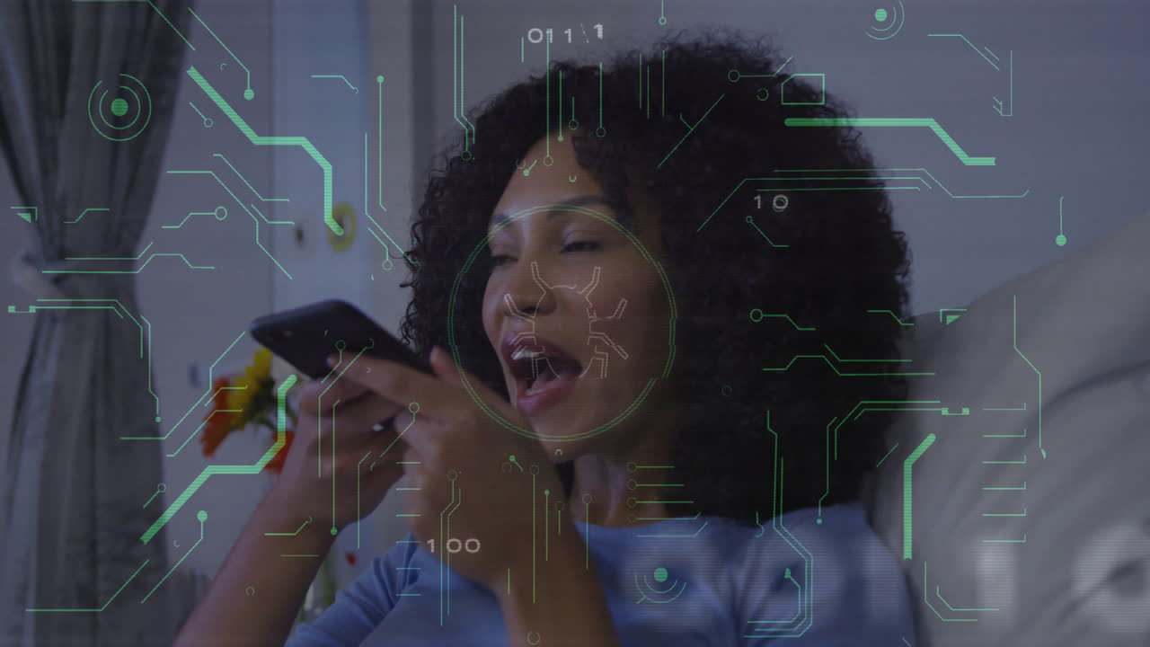 Woman speaking into smartphone at home, overlaying facial recognition graphics for technology