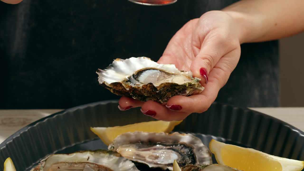 Oysters with lemon and sauce