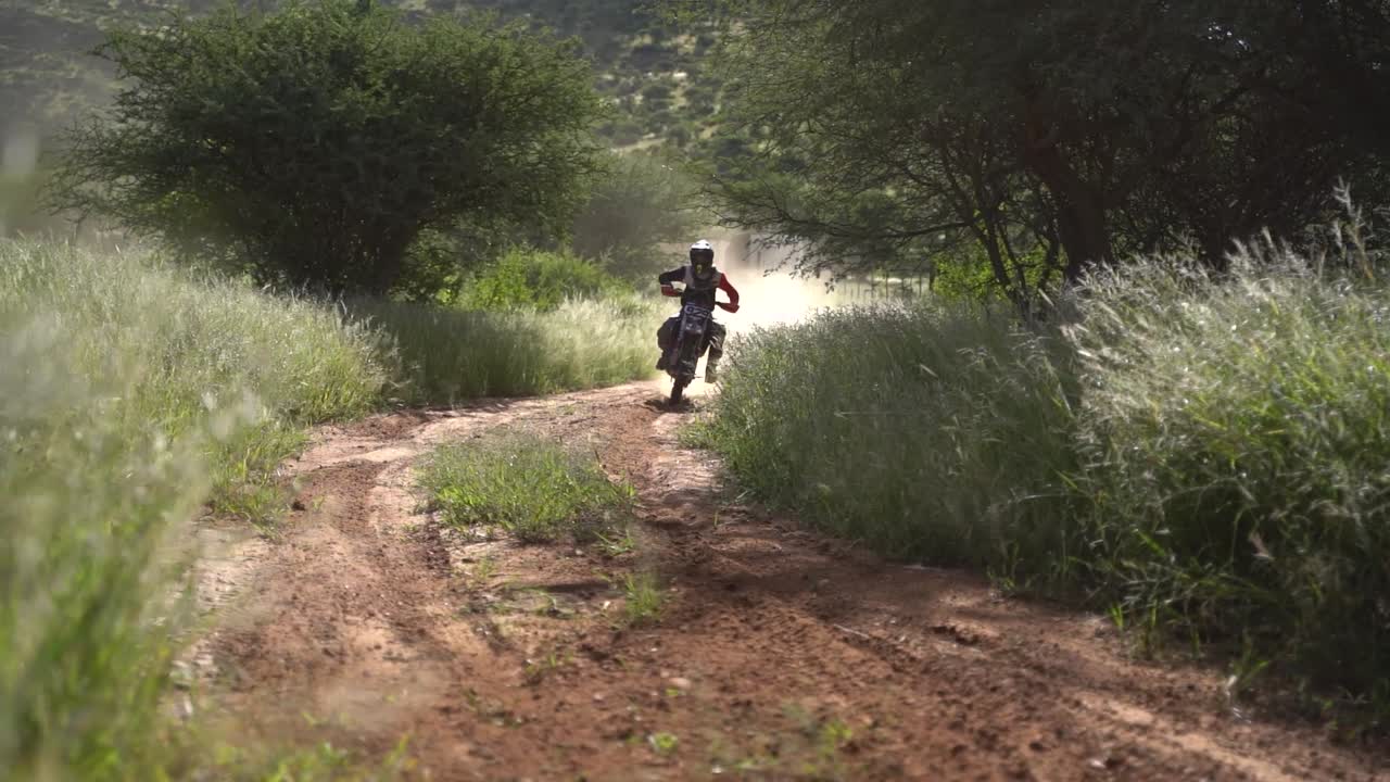 Dirt bikers racing around a corner