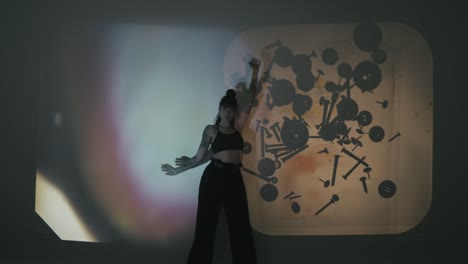 woman dancing as backgrounds change through acetates, telling a captivating story