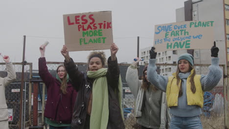 -Female-Activist-Holding-Cardboard-Placard-And-Protesting-Against-Climate-Change