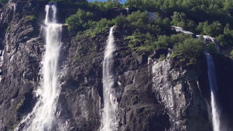 three of the seven streams of the seven sisters waterfall in geiranger fjord, norway