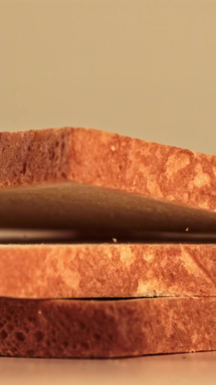 Slices of Bread Falling and Stacking in Slow Motion