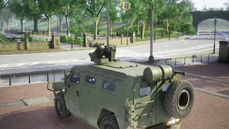 military vehicle stationed on a quiet urban street during afternoon sunlight