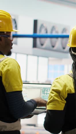 vertical video engineering team working together to conduct inspections in industry 4.0 plant