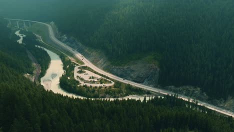 Aerial-view-cars-driving-mountain-road-in-Kicking-Horse-Pass-in-Canada