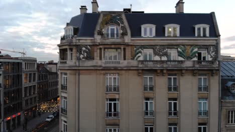 Aerial-close-flight-towards-historical-Brussels-buildings-on-cloudy-day,-Belgium