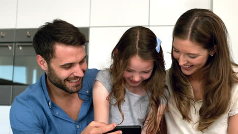 family using smartphone together