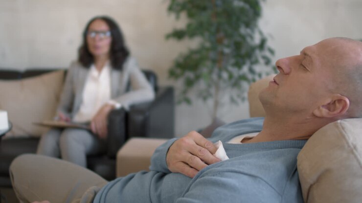 Emotional Man Sharing Problems in Therapy Session