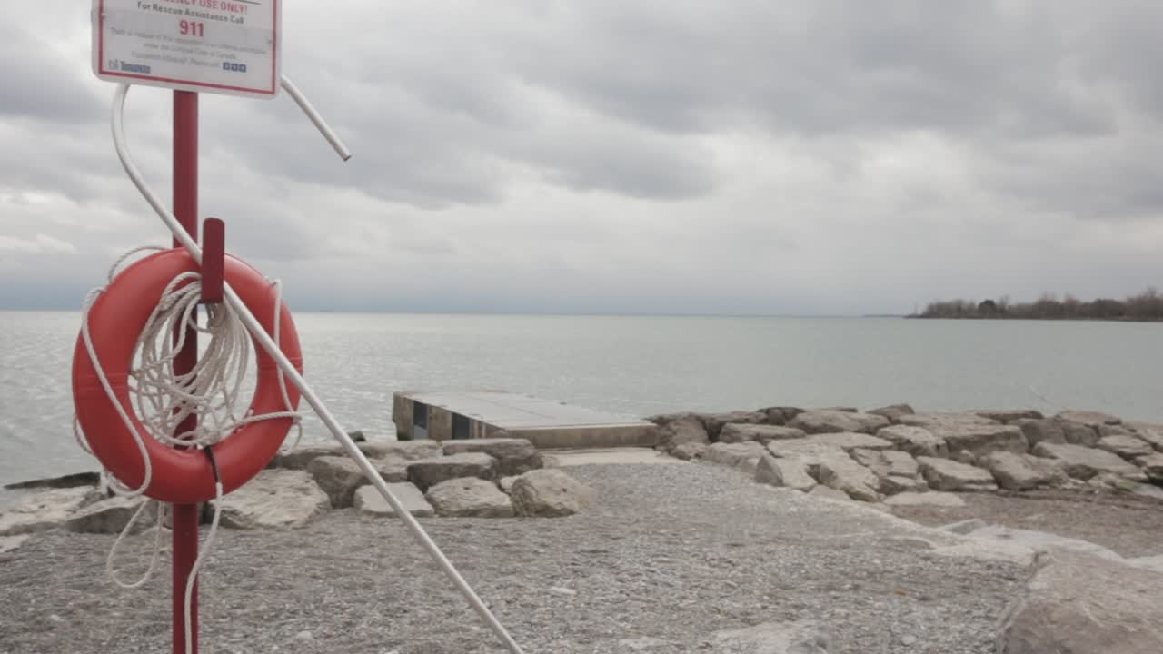 Safety Gears And Equipment Placed At One Side Of The Beach - Medium Shot