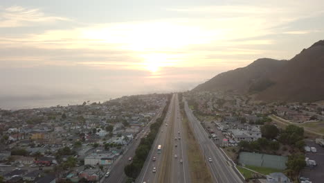aerial view of coastal highway at sunset
