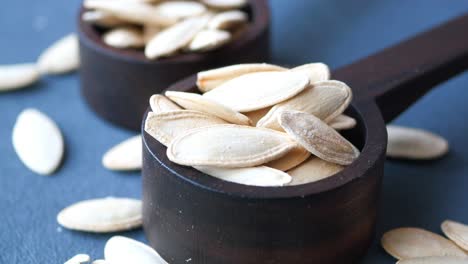 roasted pumpkin seeds in wooden bowls