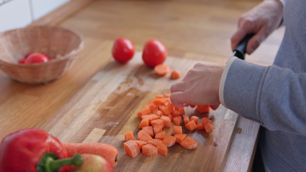 Chopping vegetables on a wooden board