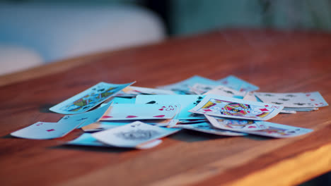 person playing cards on a table