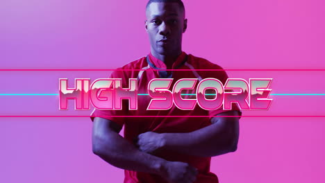 man wearing red jersey crossing arms in neon studio showing high score glitch lines for technology