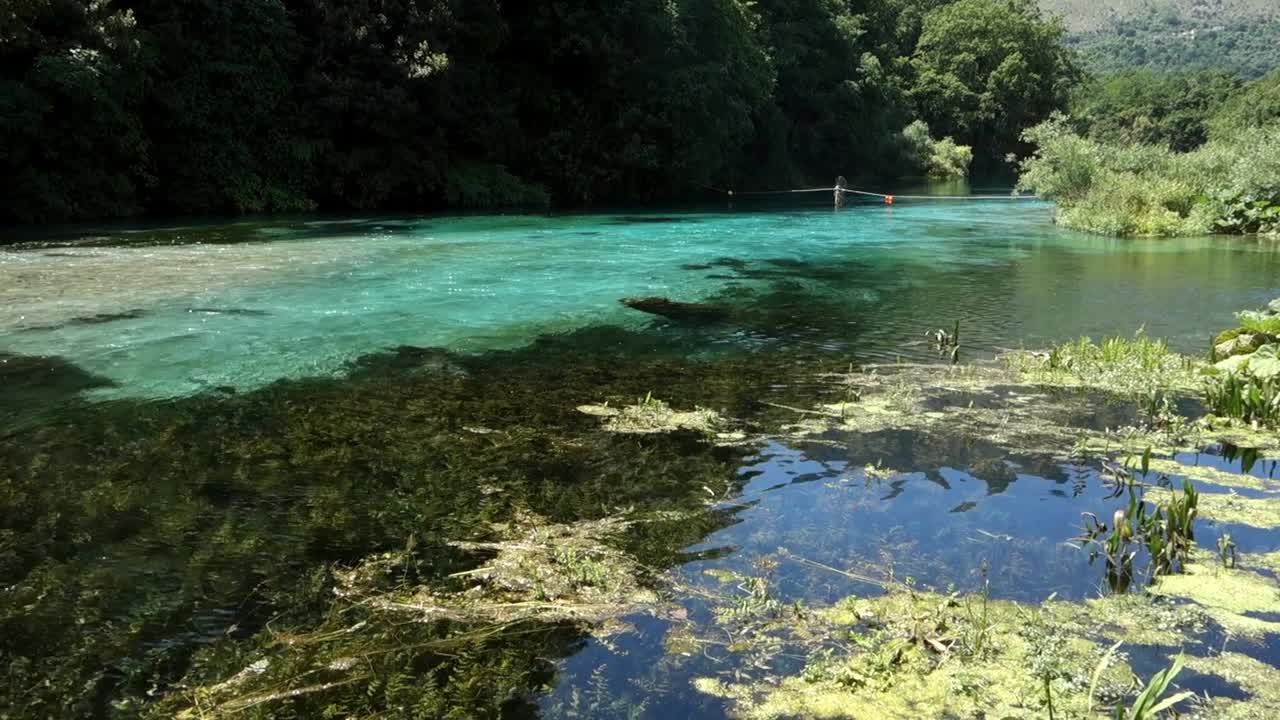 Turquoise and green water of river of Blue Eye Nature Monument near to Saranda, Albania