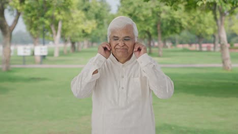 Guilty-Indian-old-man-saying-sorry-and-apologizing-in-park