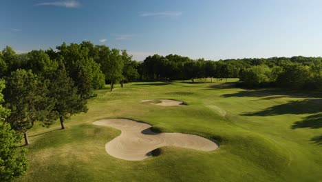 beautiful establishing shot of golf course on summer afternoon