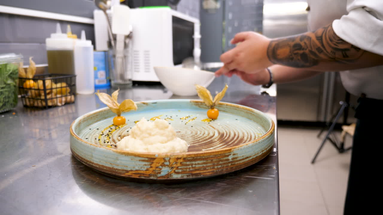 Chef Plating a Gourmet Dish in a Professional Kitchen