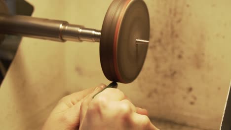 Polishing-green-stone-from-New-Zealand-with-disc-polisher-in-slow-motion
