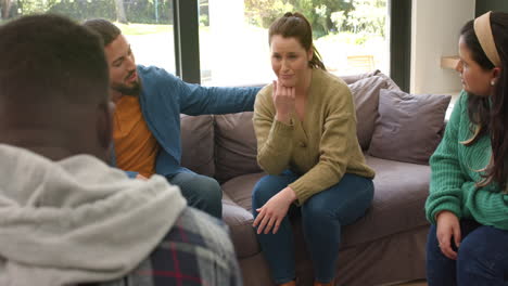 diverse group of friends talking and supporting each other in group therapy session