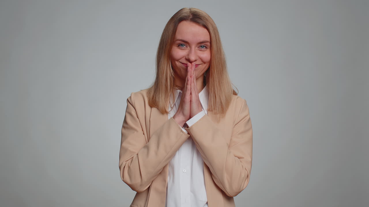 Sneaky businesswoman conspiring scheming thinking tricky plan with cunning expression joke prank