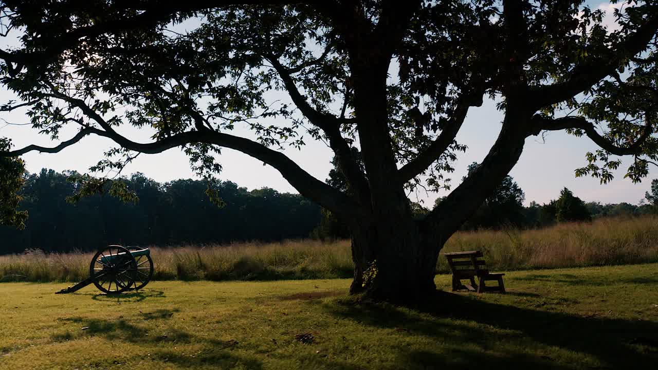 Sliding Shot of Fields Canons Trees bench and grass