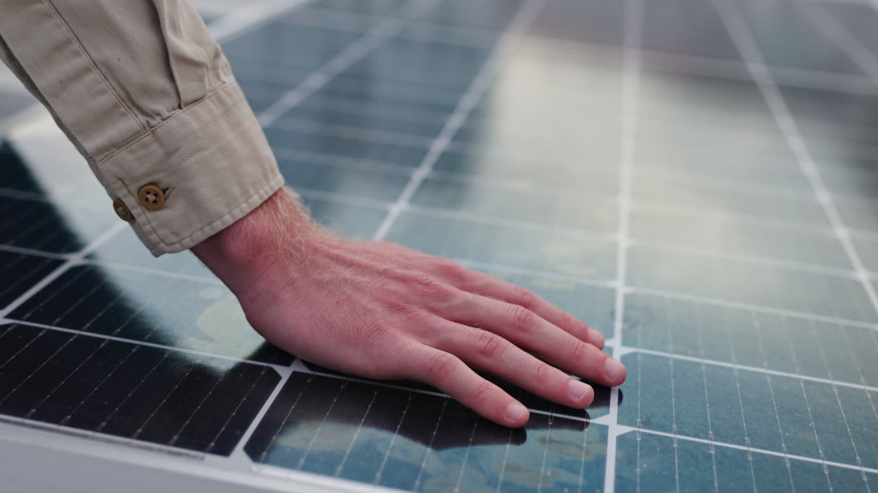 Hand on Solar Panel