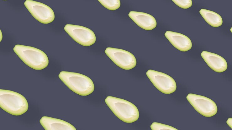 Colorful fruit pattern of fresh avocados on grey background. Seamless pattern with avocado. Realistic animation. 4K video motion
