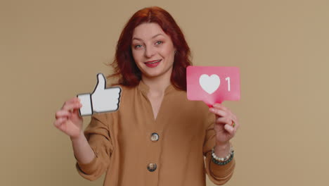 woman smiling with thumbs up and heart icon