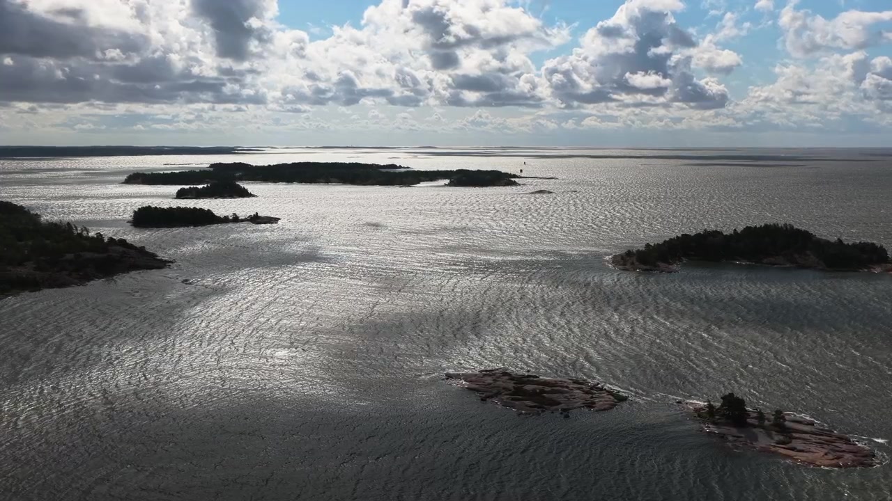 Aerial view of clouds moving over rocky islands in Kopparnäs archipelago, Finland