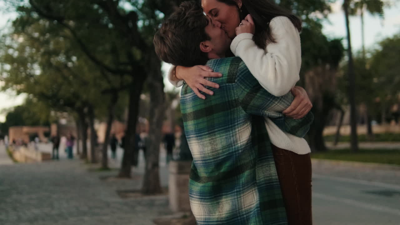 Young Couple's Romantic Stroll in Seville
