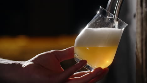 pouring a glass of light beer