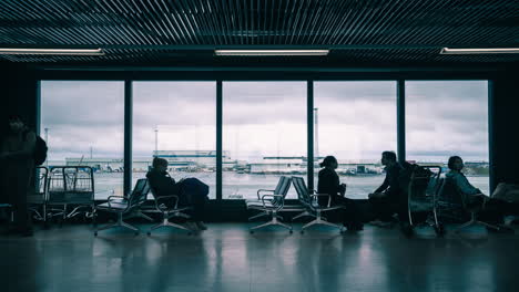 time lapse of people walking in the international airport at the departure gate.