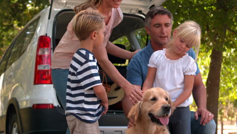 happy family with their dog in the park