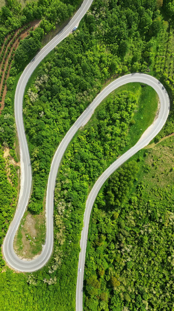 Aerial, drone view of curved road in the mountains in Serbia