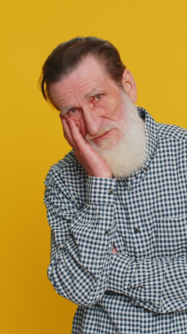 Senior man tired bored expression exhausted of tedious story not interested in communication talk