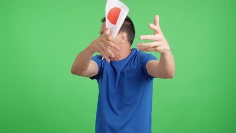 man cheering for japan, angry with the decision of referee