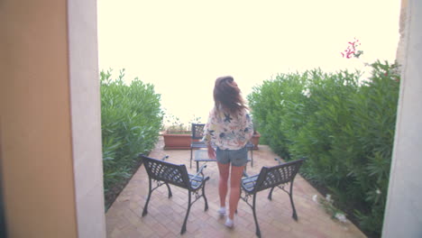 woman enjoying the garden with fountain