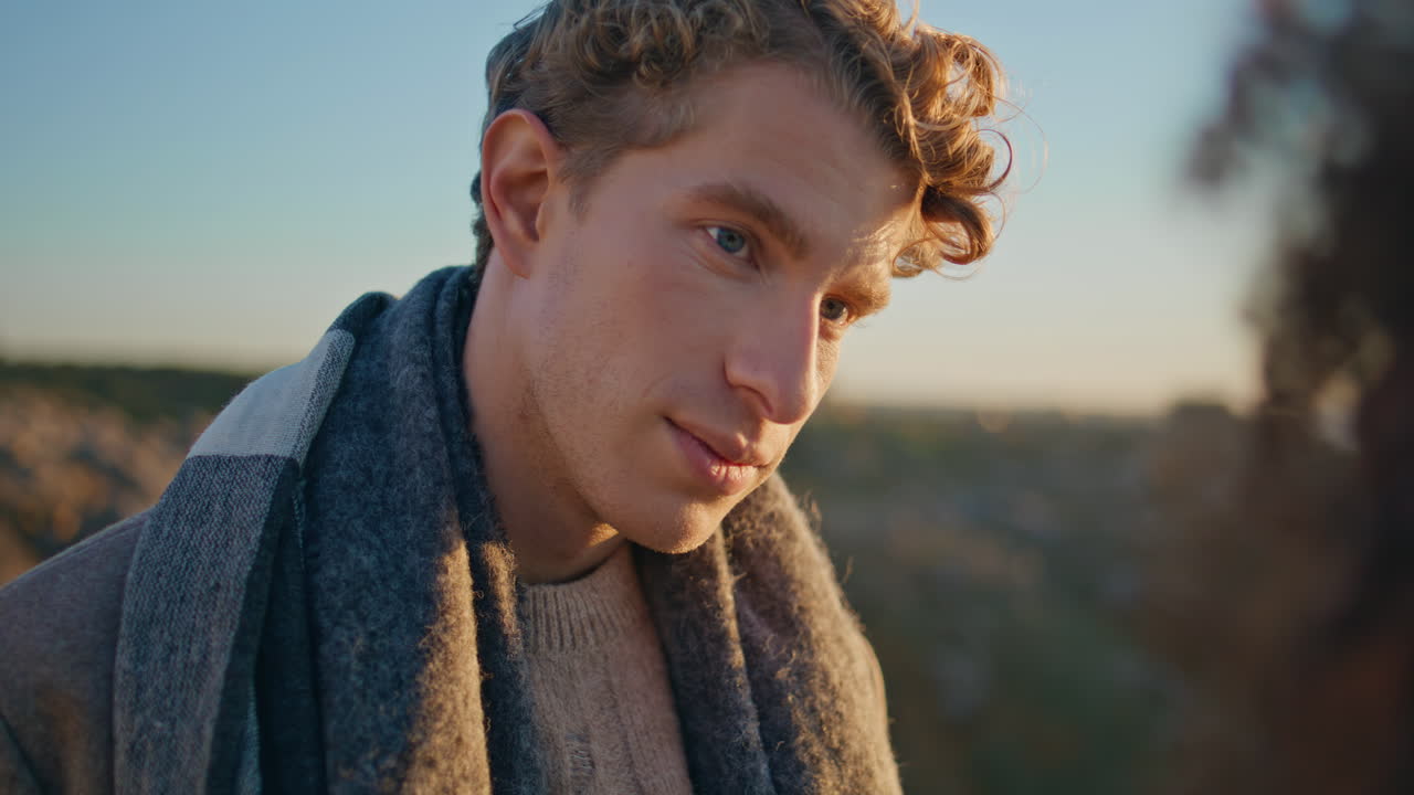 Romantic boyfriend looking girlfriend at evening nature closeup. Couple in love