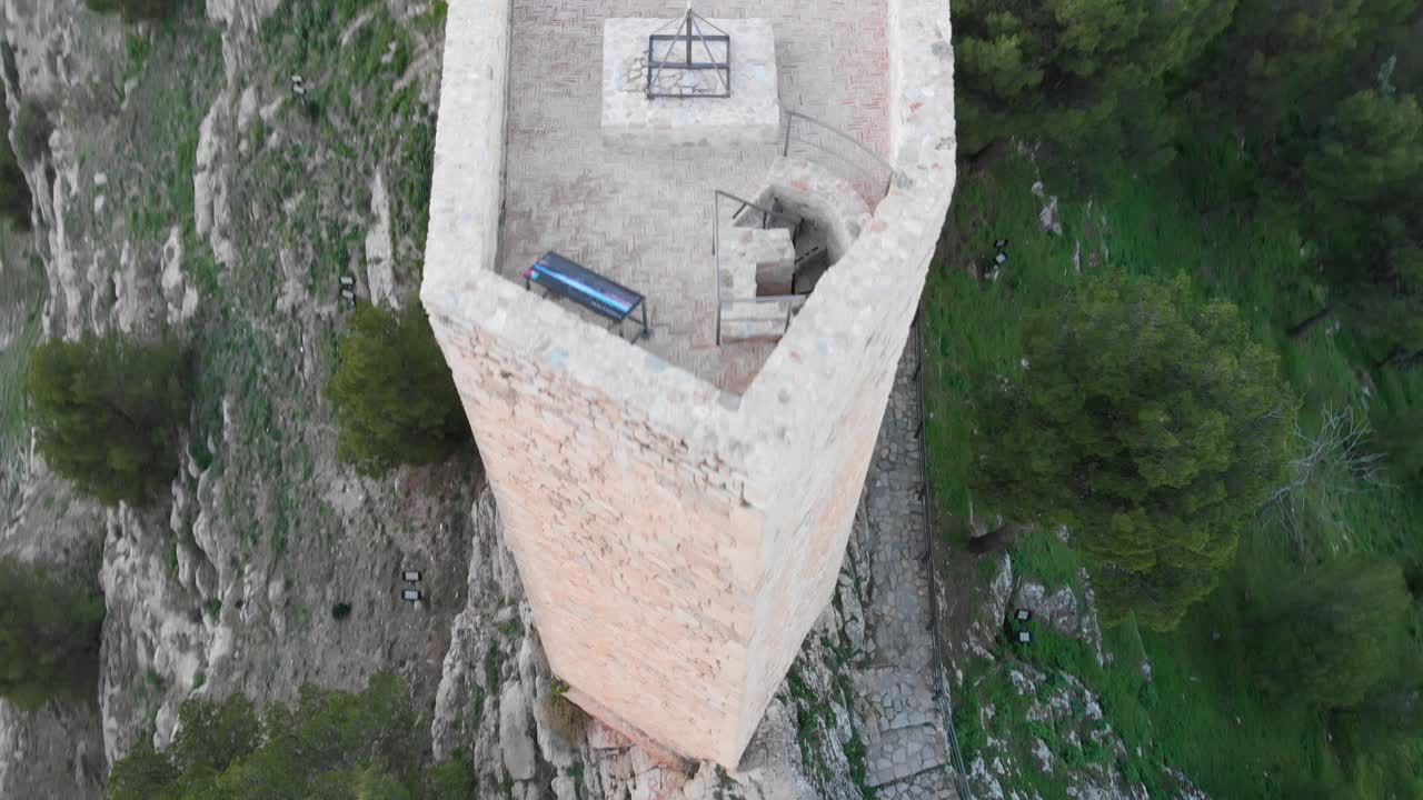 Jaen's Castle Saint Catalina Castle Spain shoot with a drone at 4k 24fps showing the exterior and the city from multiple points on a afternoon in December.