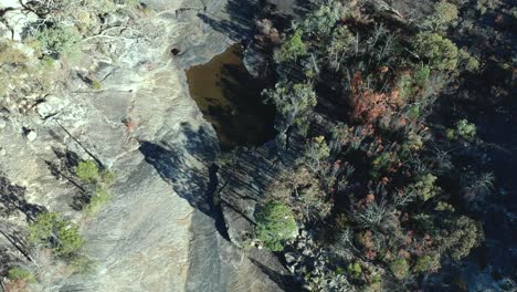 Aerial-view-of-a-dry-creek-bed-in-bush-land