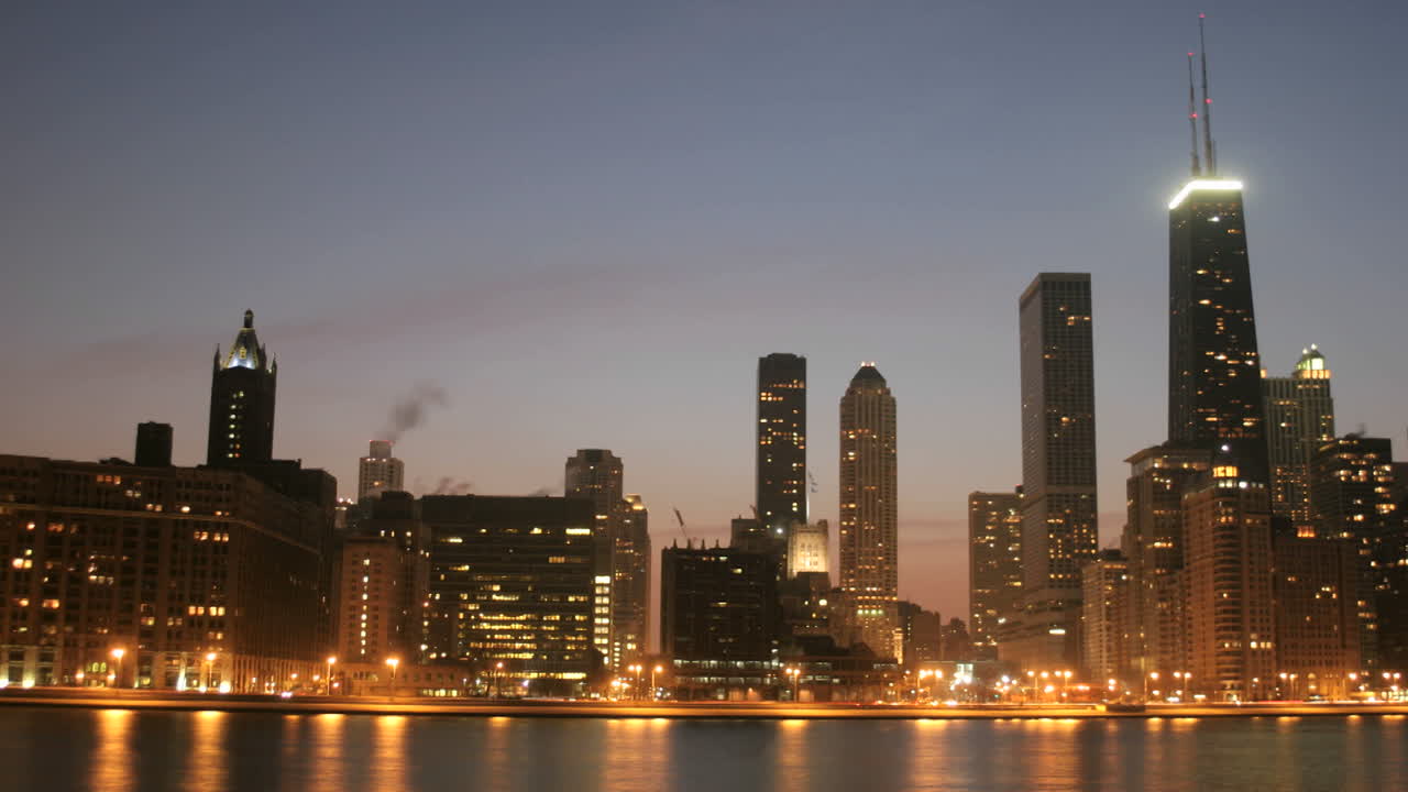 Lights brighten as the sky darkens in downtown Chicago 1